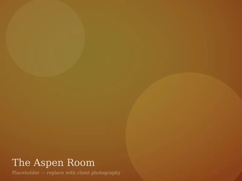 The Aspen Room private dining space set for a dinner of twenty behind a barnwood slider